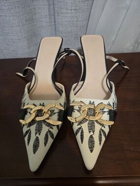 Pointed Toe Slingback Heels in Cream with Black Leaf Motif